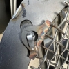 Grille showing securing tabs on reverse of grille 